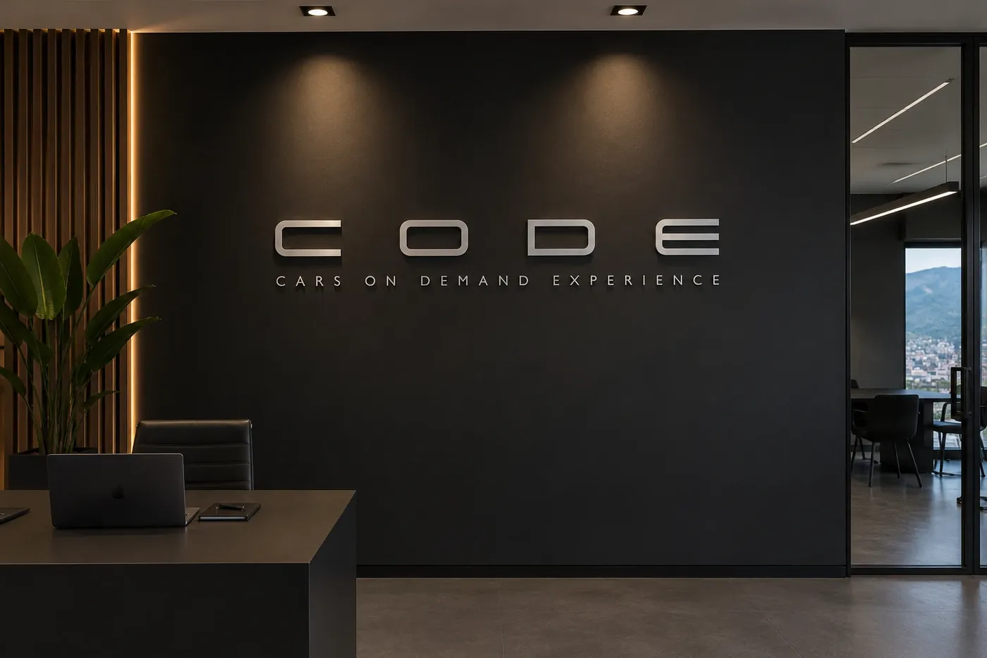 Oficina de CODE Cars con el logo en la pared